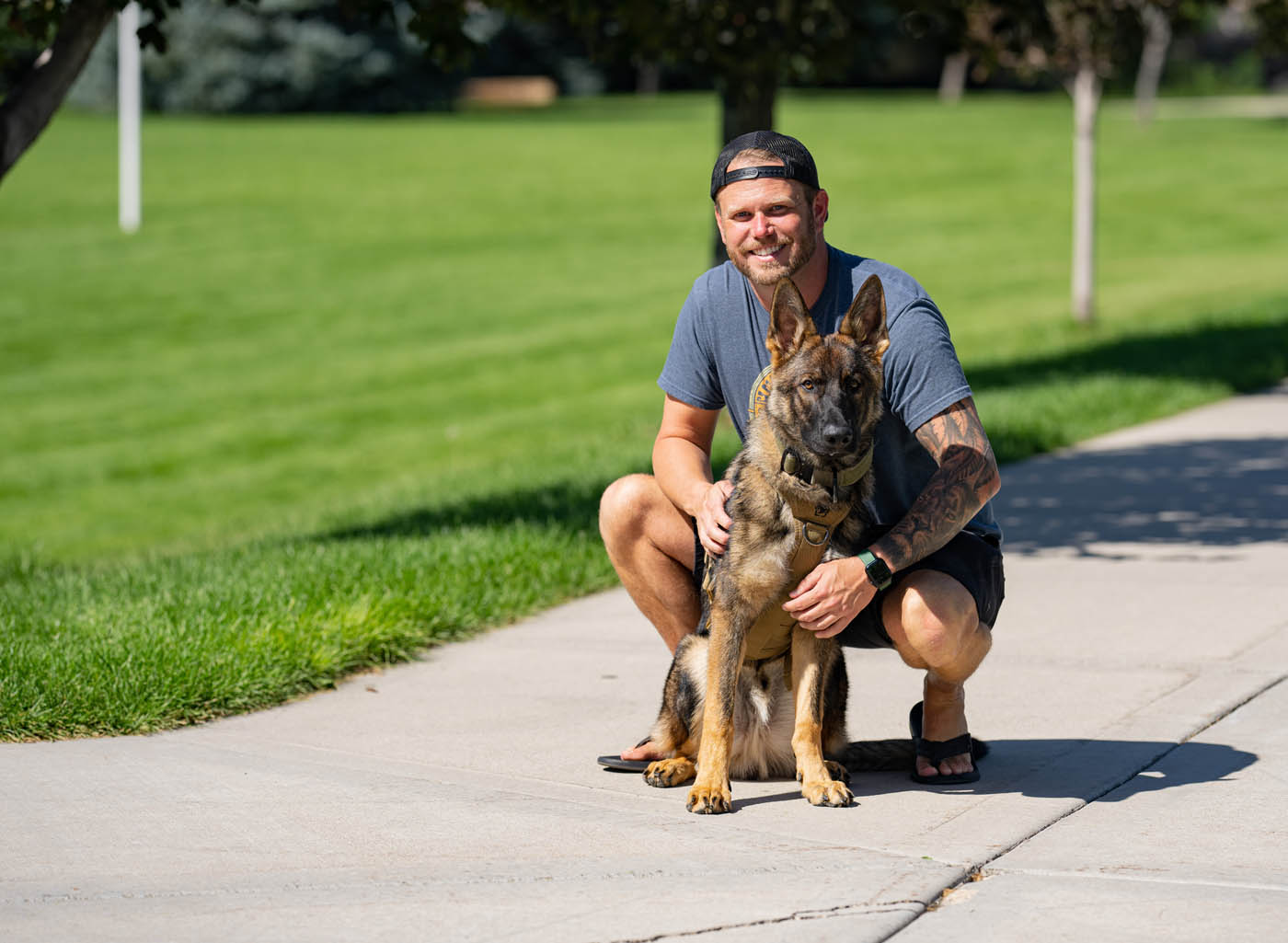 A dog owner with his German Shepherd - get your professional german shepherd training in Fort Wayne, IN with Dog Training Elite today.