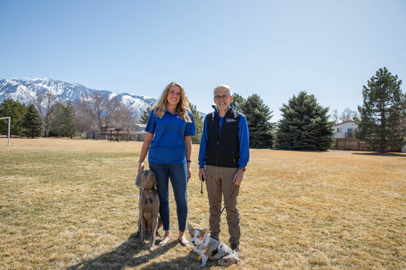 Two Dog Training Elite experts teaching dogs at one of our expert Boston dog training classes.